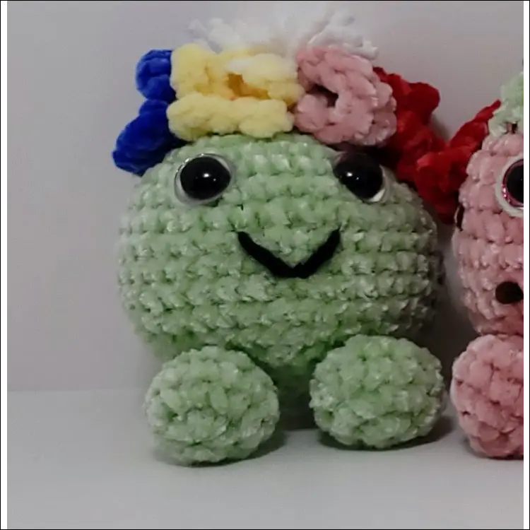 Two adorable hand-crocheted forest sprites with a cute water drop design