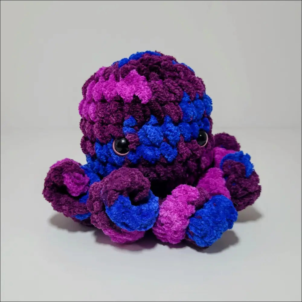Colorful octopus plush toy in purple and blue, perfect for snuggles and playtime