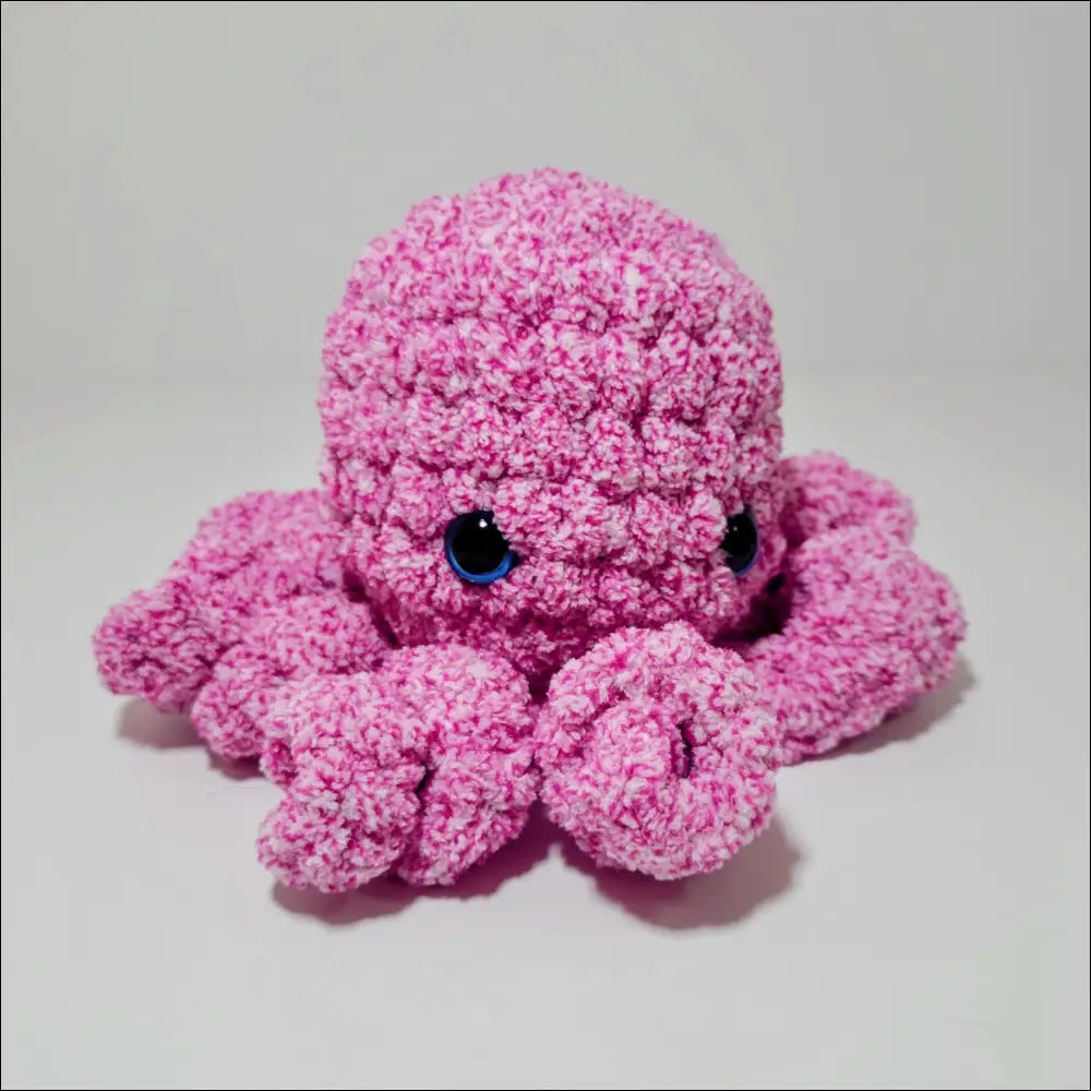 Cute pink octopus plush toy with soft tentacles and blue eyes for snuggles