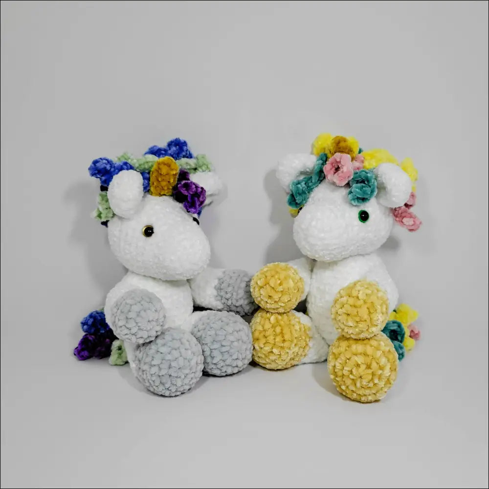 Two cute unicorn plushies with floral crowns, perfect for snuggles at checkout