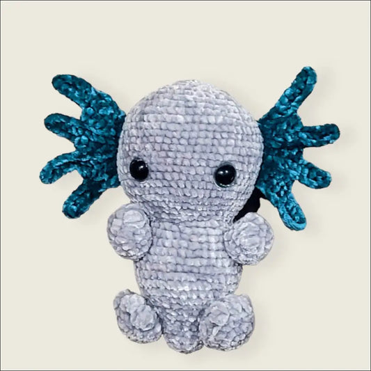 Cute axolotl toy with teal gills and a gray body, perfect for cuddly fun!