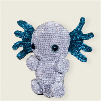 Adorable axolotl toy with blue gills and a soft, pale body perfect for cuddly fun