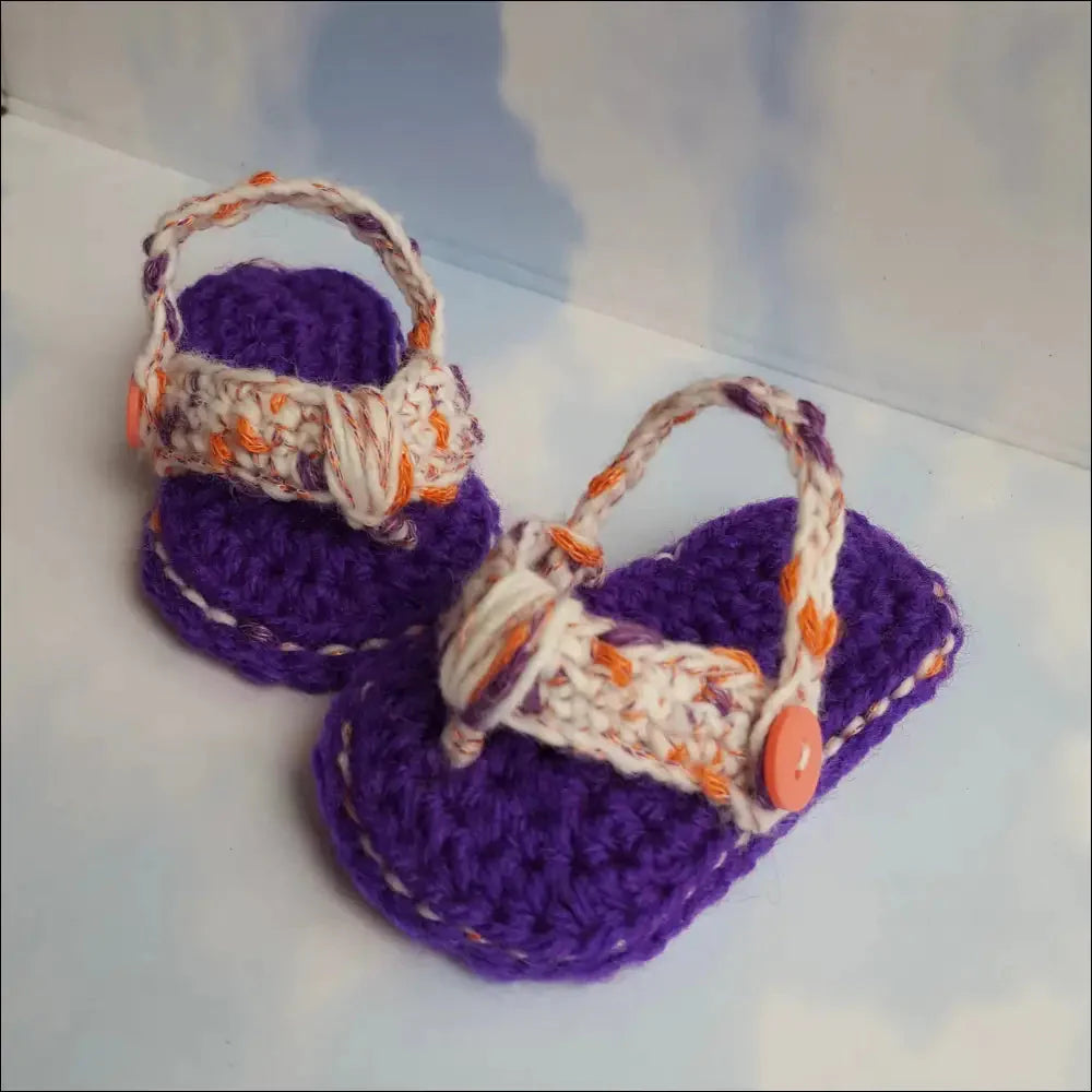 Adorable pair of crocheted purple and multicolored baby flip flops for summer fun