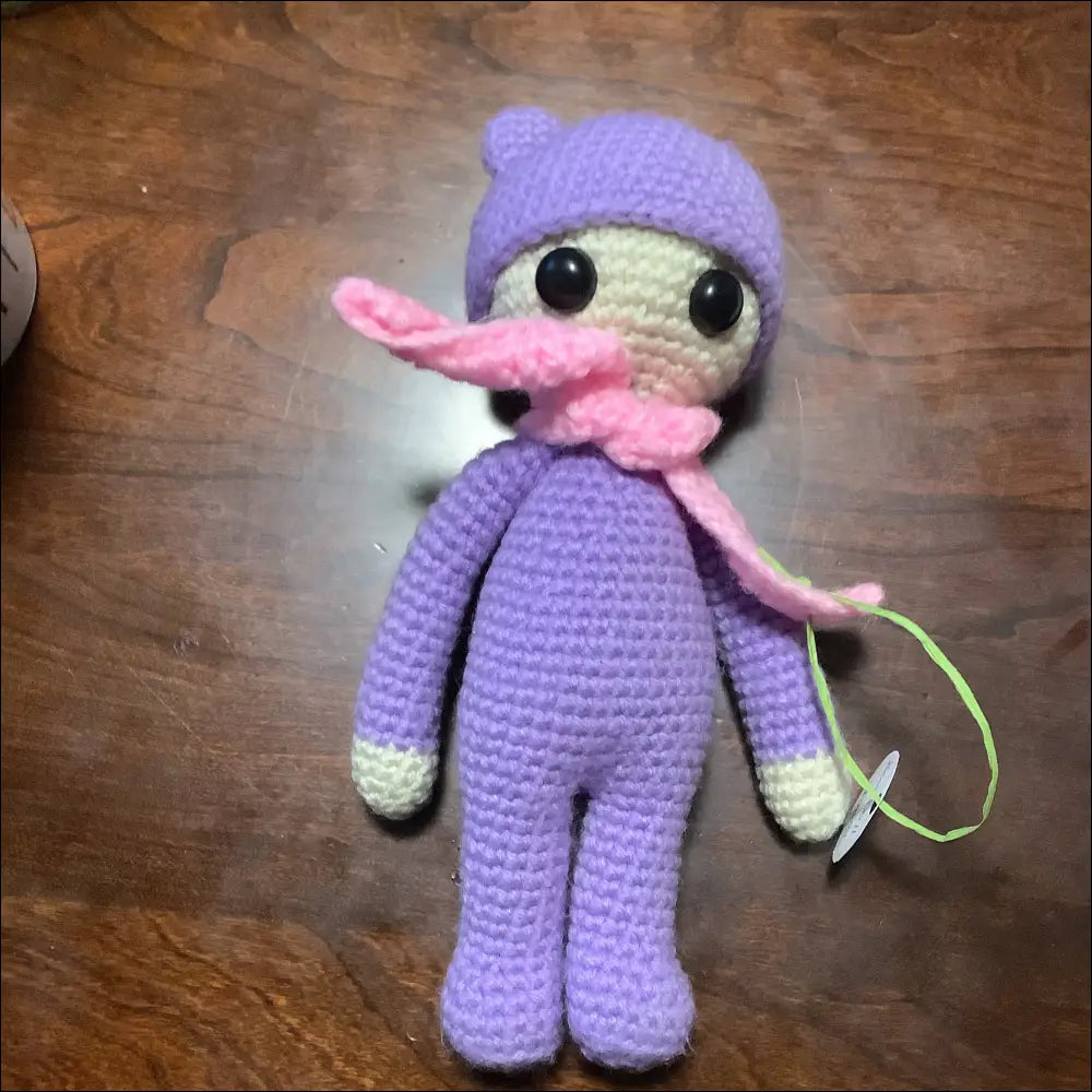 Crocheted purple bear doll with big eyes and a pink scarf, perfect new best friend!