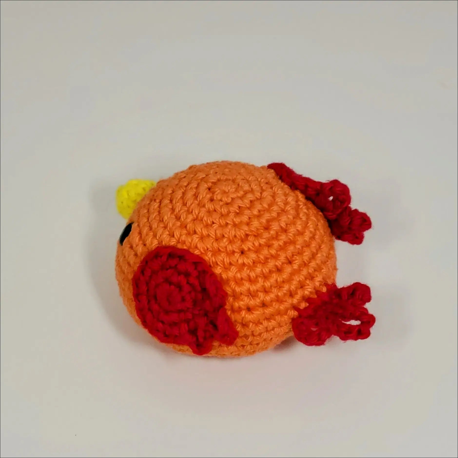 Cute red flower crochet on a Blobimals Bunny, Panda, or Giraffe for playtime fun