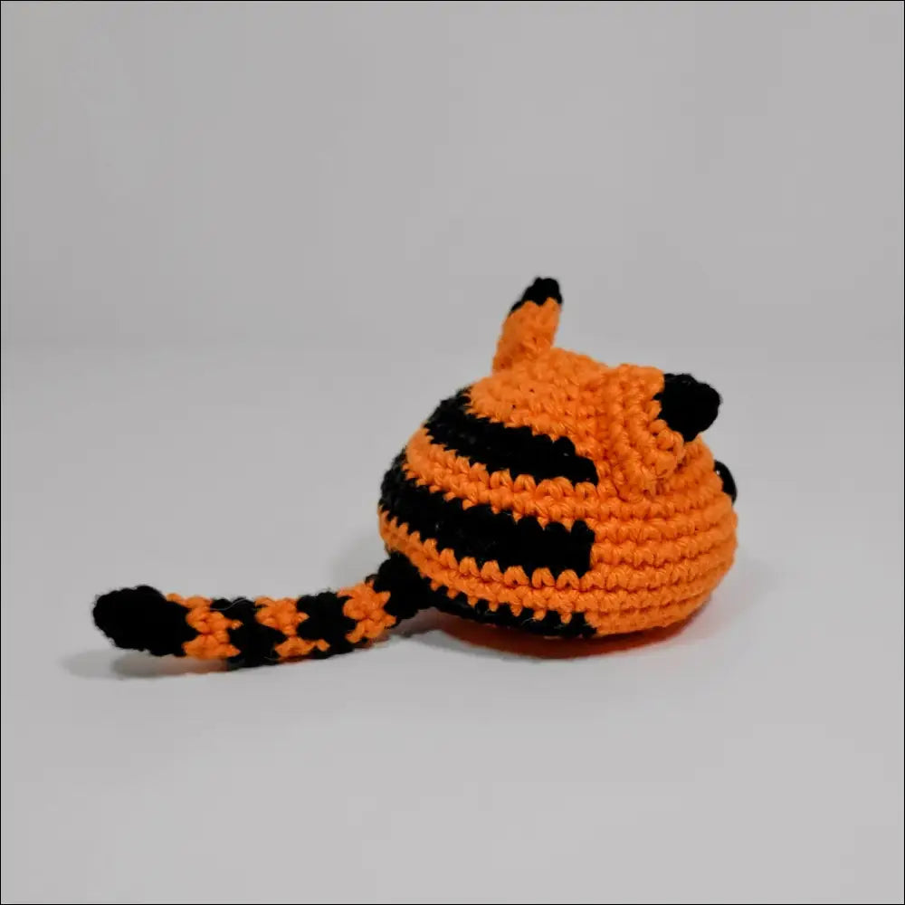 Crochet cat hat with black and orange stripes for fun Blobimals playtime joy