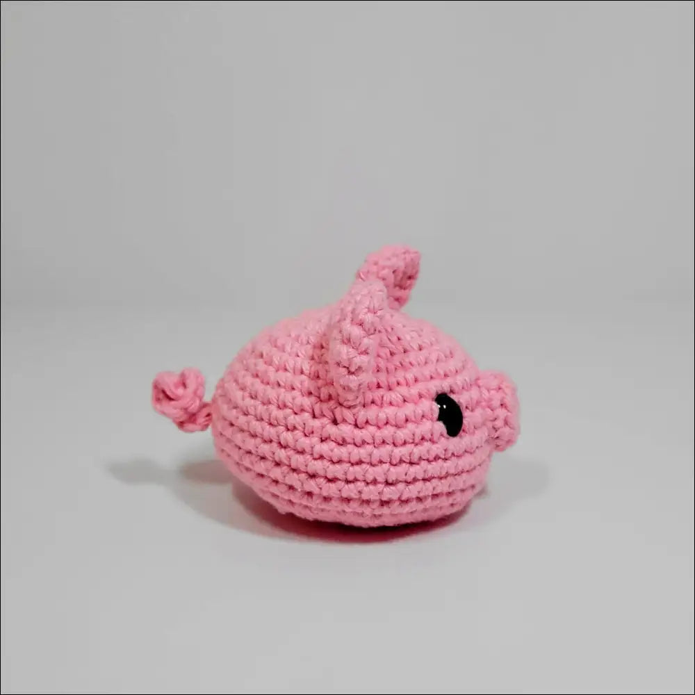 Cute pink crochet whale toy on white background from Blobimals for fun playtime joy