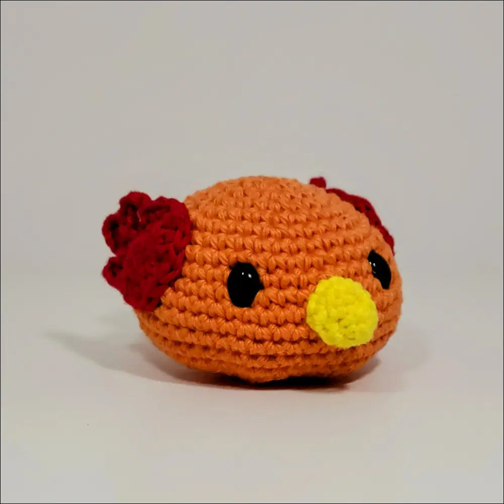 Cute crochet chicken with yellow flower, perfect for Blobimals fun playtime!