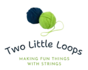 Blue and green yarn balls with a white plastic hook attached.