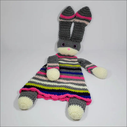 Crochet bunny in a striped dress, perfect as a cozy bunny lovey for sweet dreams