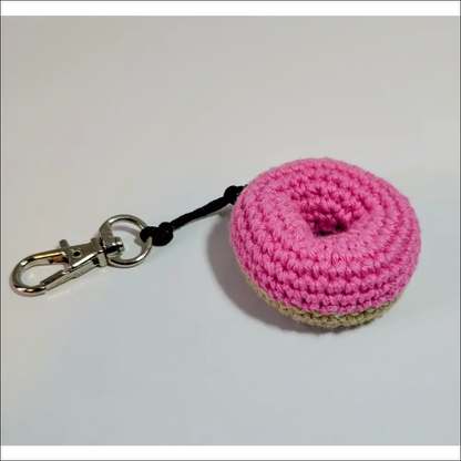 Pink crochet keychain with black handle perfect for your coffee cup and more