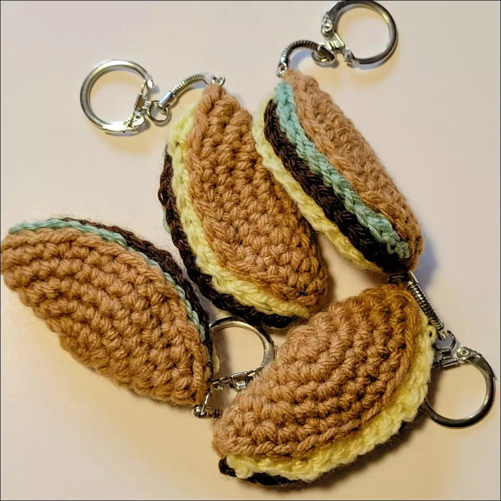 Colorful crocheted taco-shaped keychains perfect for your coffee cup and more