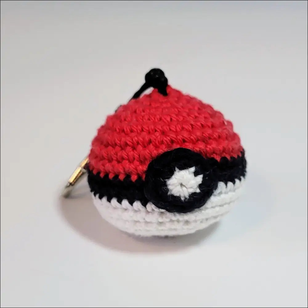 Trendy Crochet Keychain featuring a red and black ball for your coffee cup