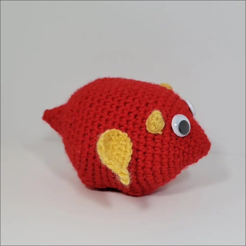 Red crochet fish with yellow eyes for Cute and Goofy Derpy Dragon Plush Toy