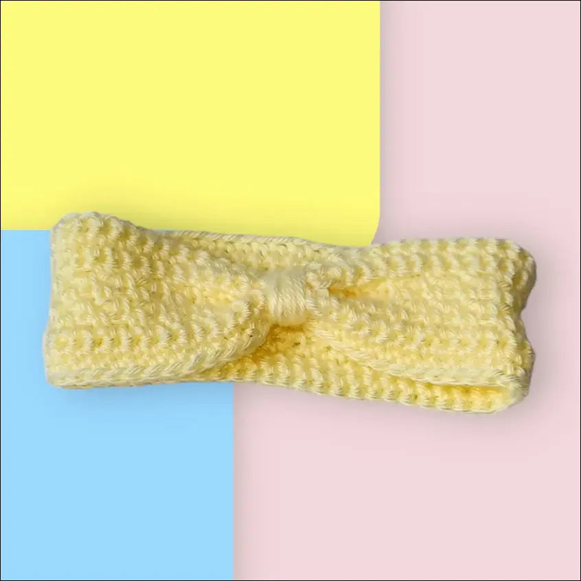Yellow knitted bow tie on Cozy Cream Ear-warmer Headband for 6-12 months