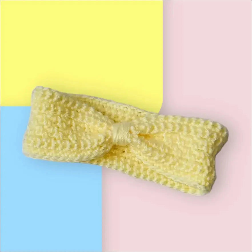 Pale yellow bow accessory on a Cozy Cream Ear-warmer Headband for 6-12 months