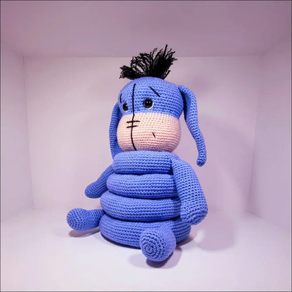 Crochet Eeyore Stacker Toy sitting on a white surface for fun playtime adventures