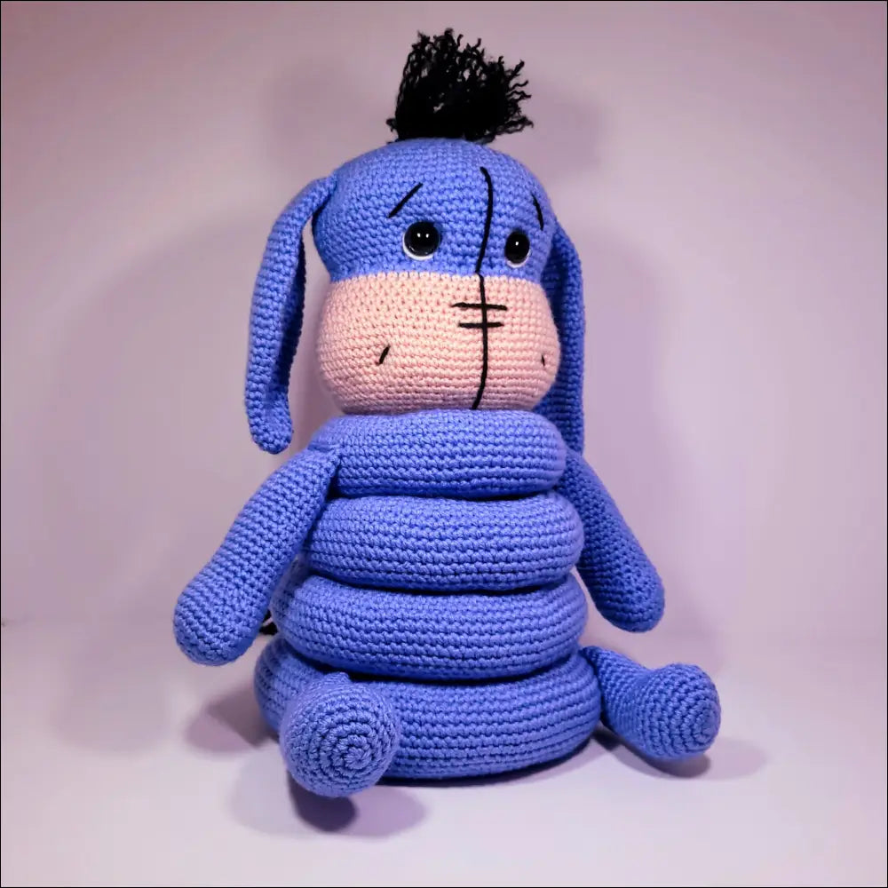 Stuffed Blue Dog on White Table for Eeyore Stacker Toy Fun and Playtime Adventures