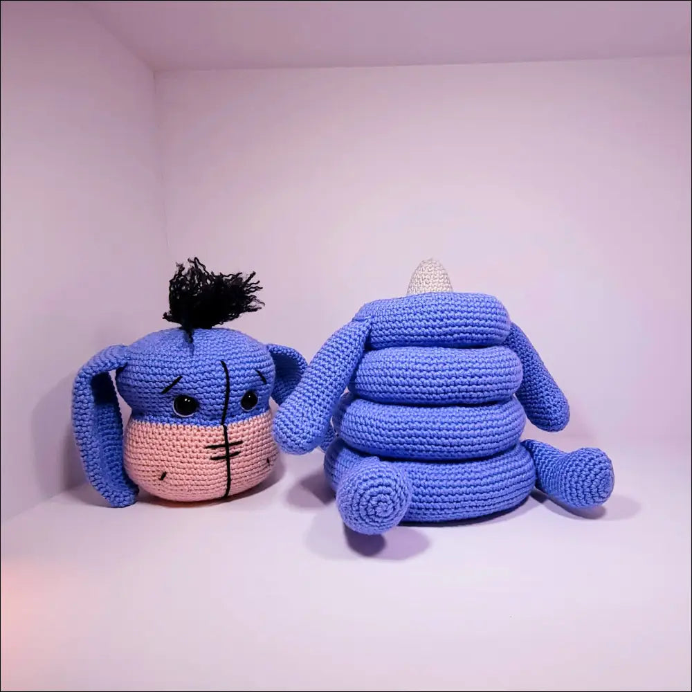 Two cute croches sitting together next to the Eeyore Stacker Toy for fun playtime