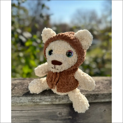 Fluffy bear in a cozy brown hood, perfect for cuddles and snuggles