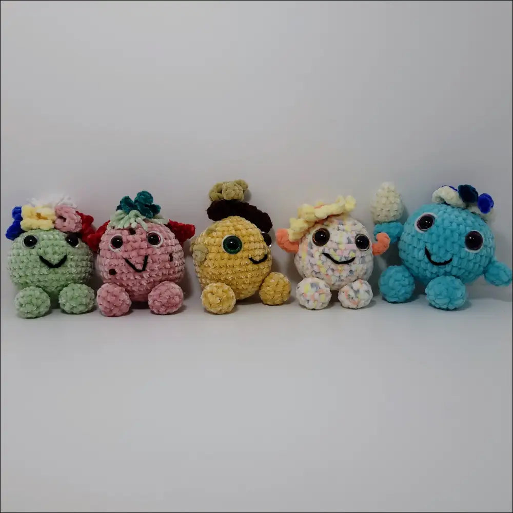 Colorful Hand-crocheted Forest Sprites with Water Drop Design in a charming display