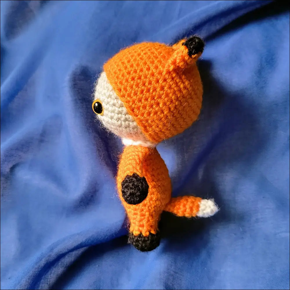 Adorable Crocheted orange fox pal, perfect for adventures and playtime fun!