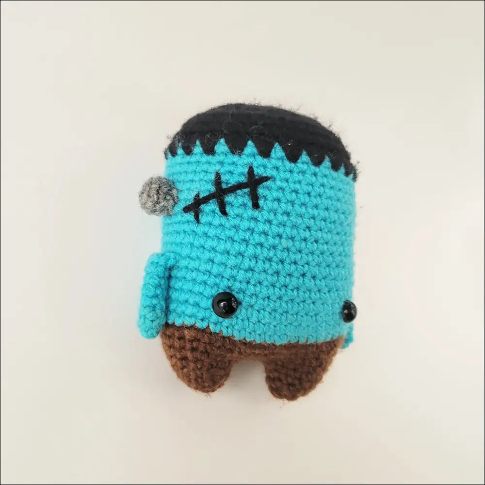 Cute Crocheted Blue Frankenstein Toy with Turquoise Body and Black Hair for Your Collection