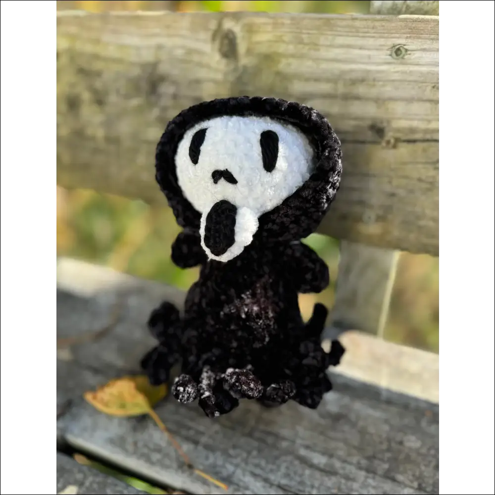 Crocheted ghost face figure with a spooky vibe for your Halloween decor