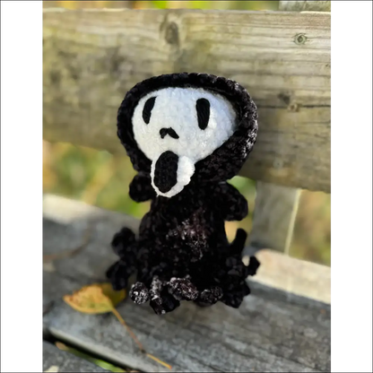 Crocheted ghost face figure with a spooky vibe for your Halloween decor