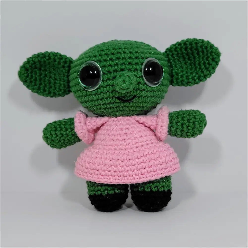 Small green crocheted doll in pink dress from Goblins Fun Pals with calculated shipping