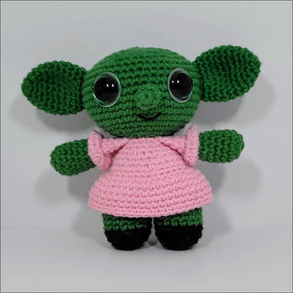 Small green crocheted doll in pink dress from Goblins Fun Pals with calculated shipping