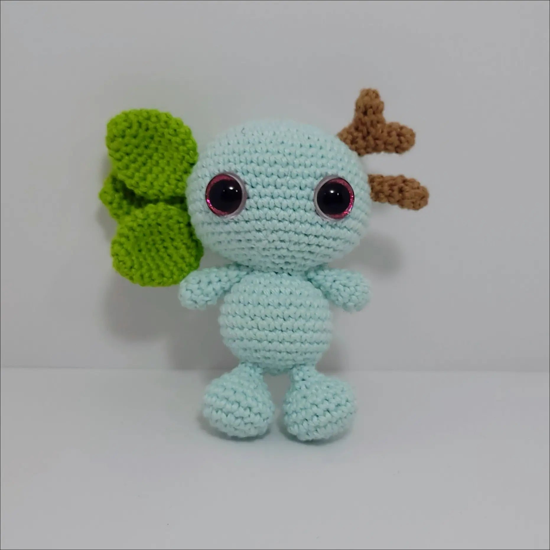 Crochet doll with green leaf, part of Impkins Enchanted Forest Fairy Creatures in green blue multi