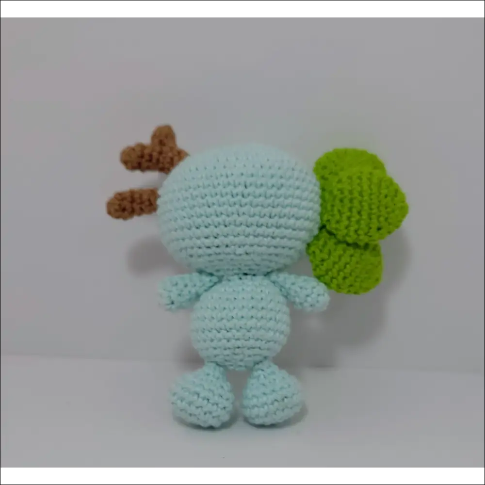 Crochet doll with a green leaf, part of Impkins Enchanted Forest Fairy Creatures in green blue multi