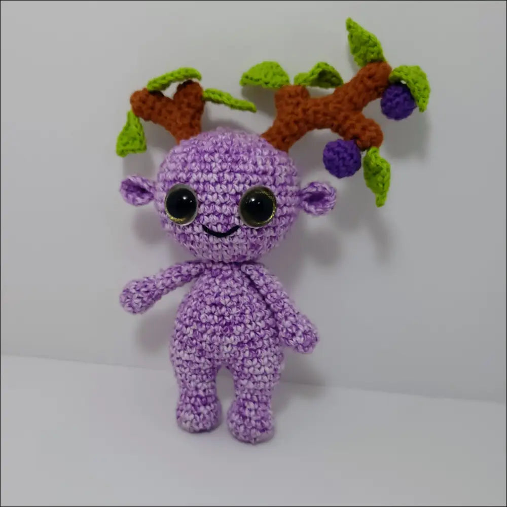 Purple crochet with a green leaf on Impkins Enchanted Forest Fairy Creatures in green blue multi