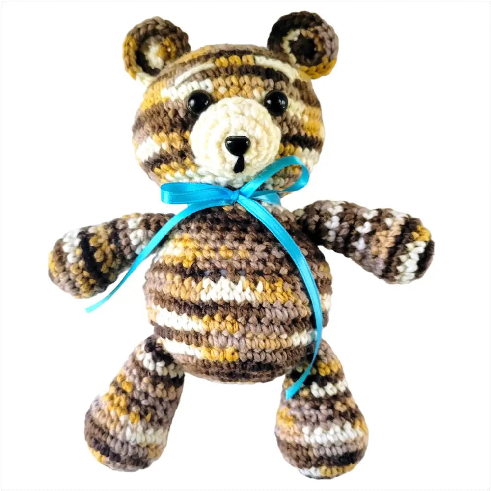 Crocheted Jeremy Bear with striped fur and blue ribbon bow for comfort on the go