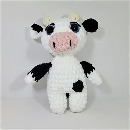 Cozy Jersey Cow Plush with big blue eyes, perfect for snuggles and playtime fun