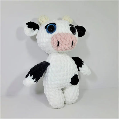 Cozy Jersey Cow Plush toy, soft white and black design, perfect for snuggles and playtime