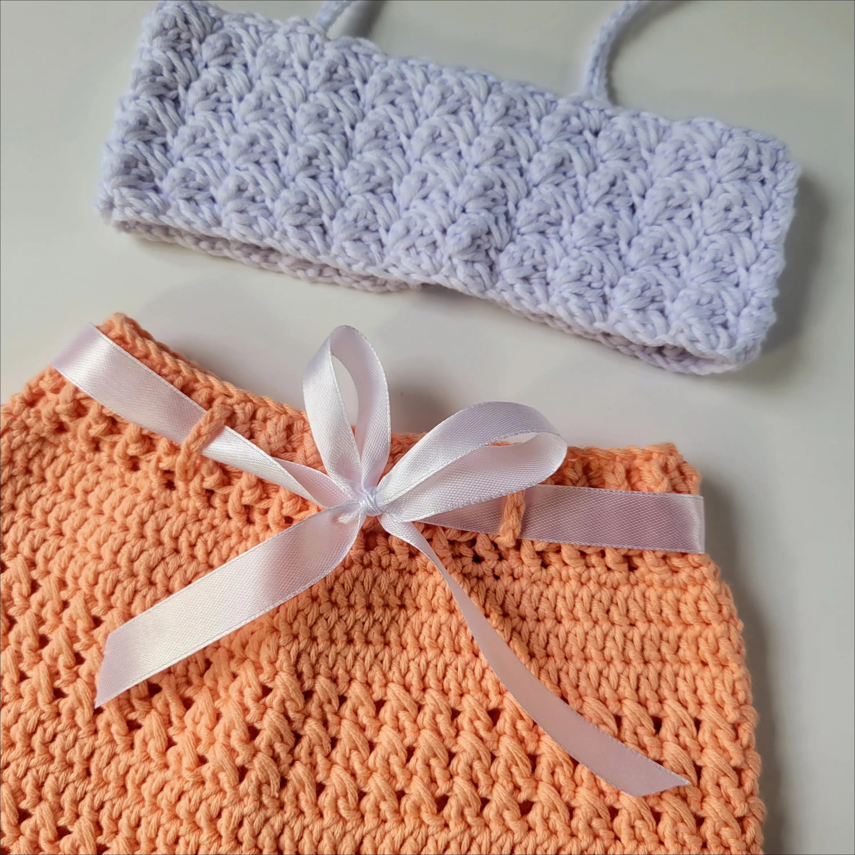 Crocheted orange Peachy Short Set for Baby and Toddler with white ribbon bow