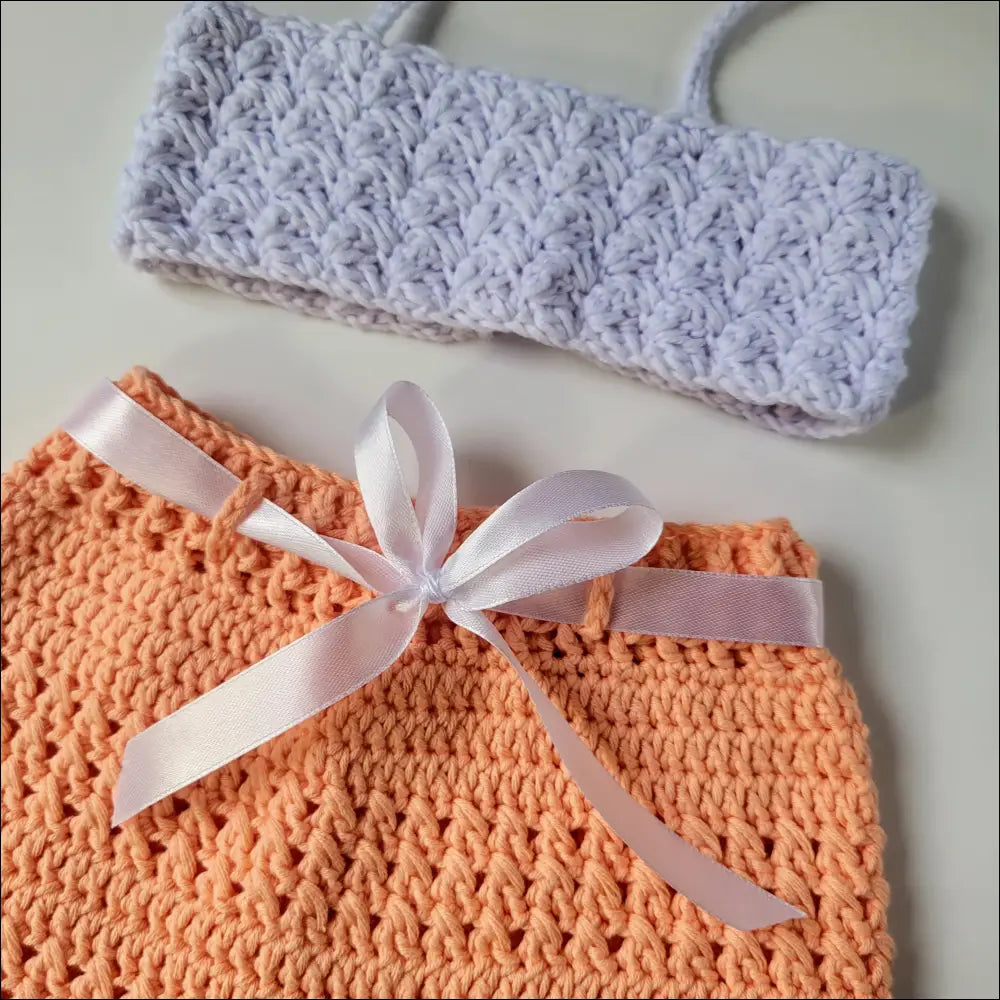 Crocheted orange Peachy Short Set for Baby and Toddler with white ribbon bow