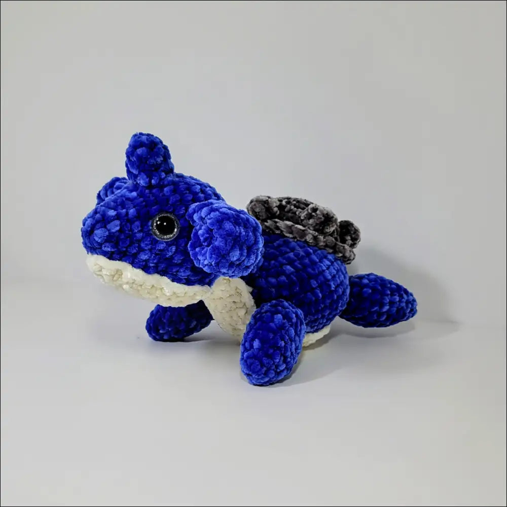 Cute Lapras Plush featuring a blue dragon design with white underbelly and gray spikes