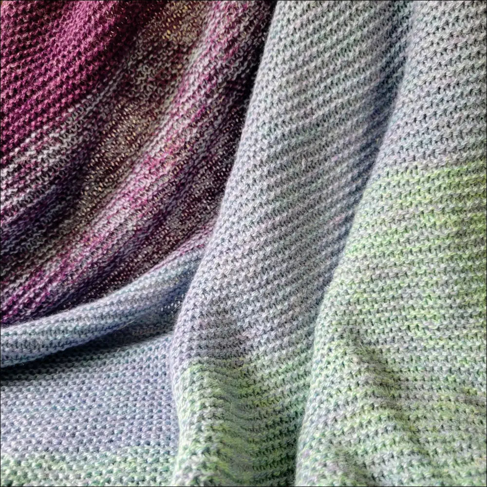 Knitted fabric in purple, gray, and green for a luxe gradient baby blanket