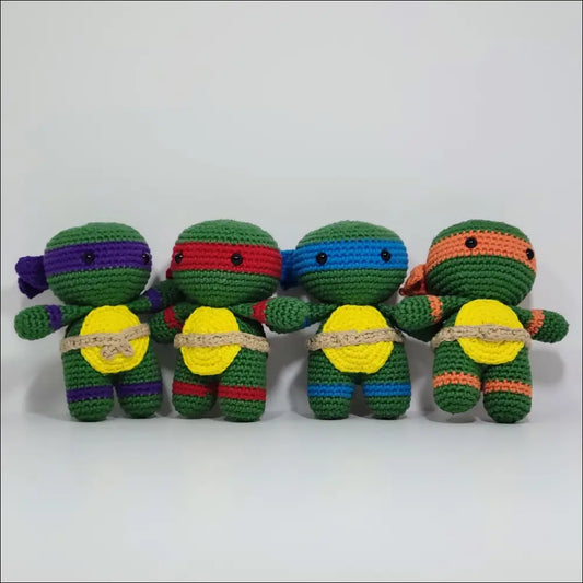 Colorful Crochet Ninja Turtles with a turtle on top, perfect for sleepy little fans