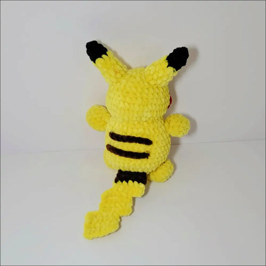 Crocheted yellow Pikachu plush toy with black details, perfect for joyful playtime adventures