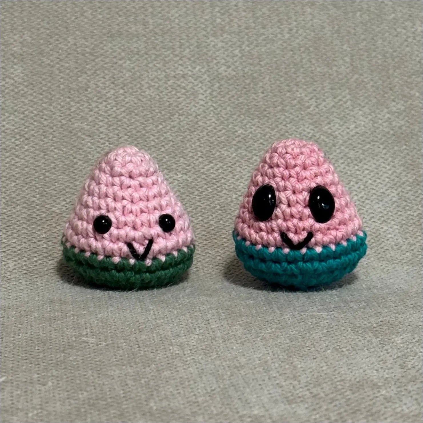 Two small crocheted watermelon slices