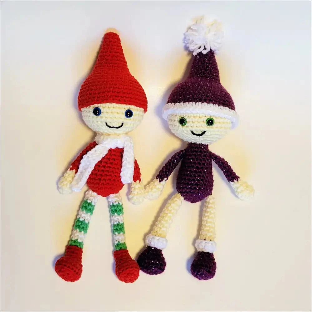 Two playful elves crochet dolls with smiles and pointed hats for holiday cheer