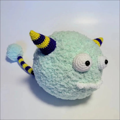 Mint green Fluffy Puff Ball Monster Toy with striped horns and tail, perfect for fun adventures