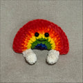 Colorful Rainbow with legs on a gray fabric backgound