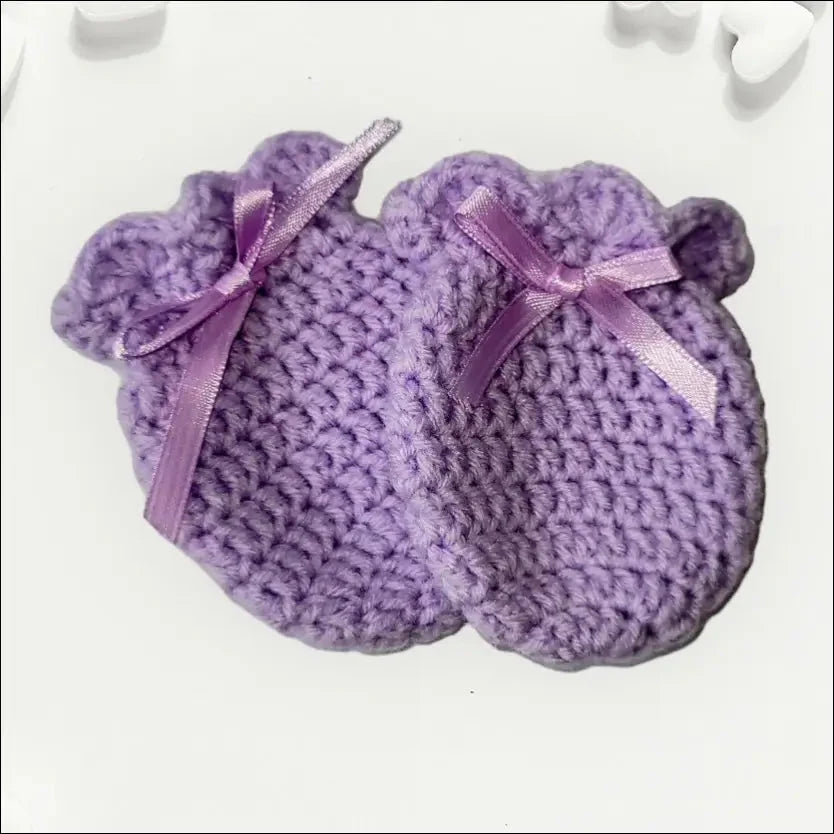 Cozy Winter Scratch Mitts in purple with bows for your little one’s chilly days