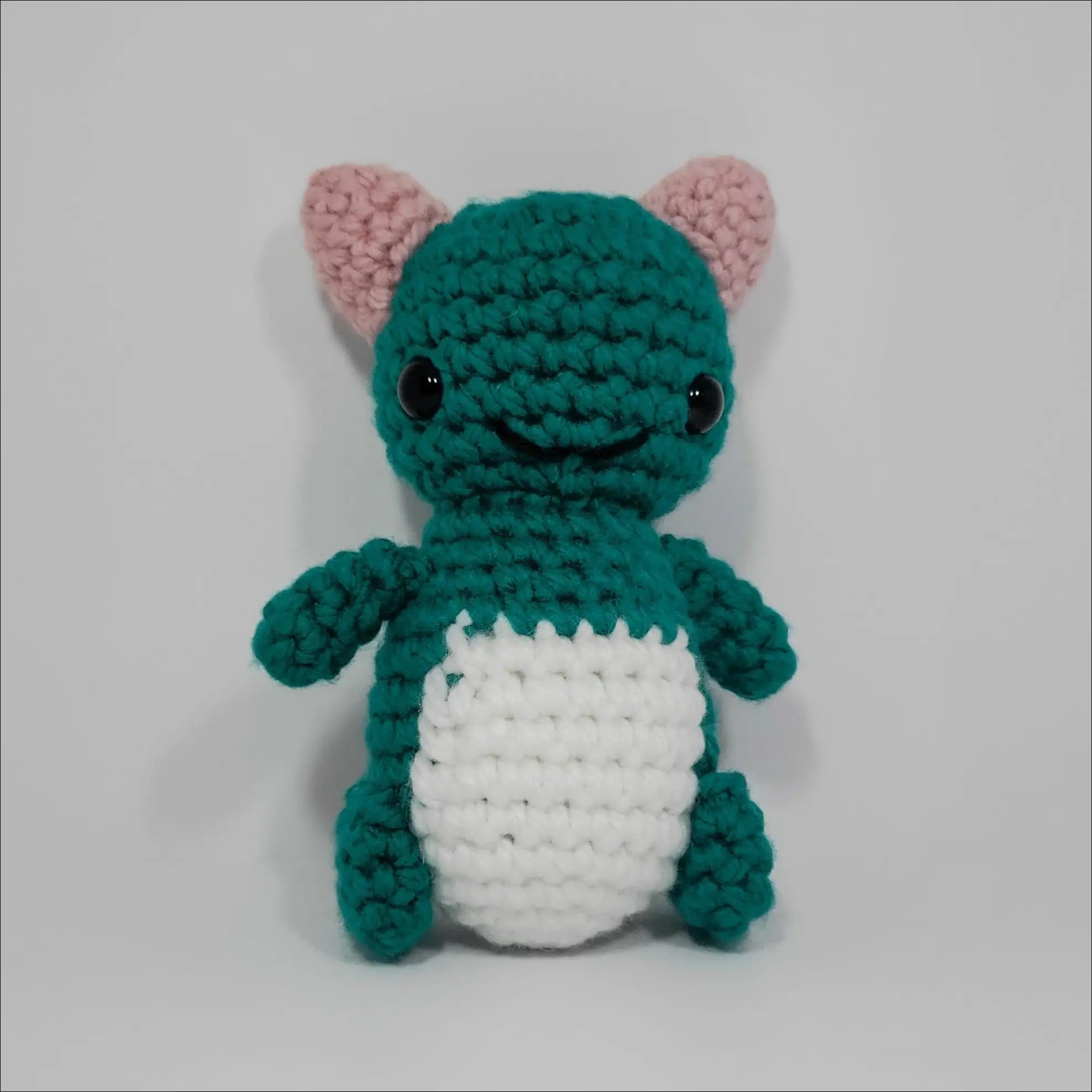 Adorable small green and white Silly Monster Plush with a big eye for laughs and cuddles