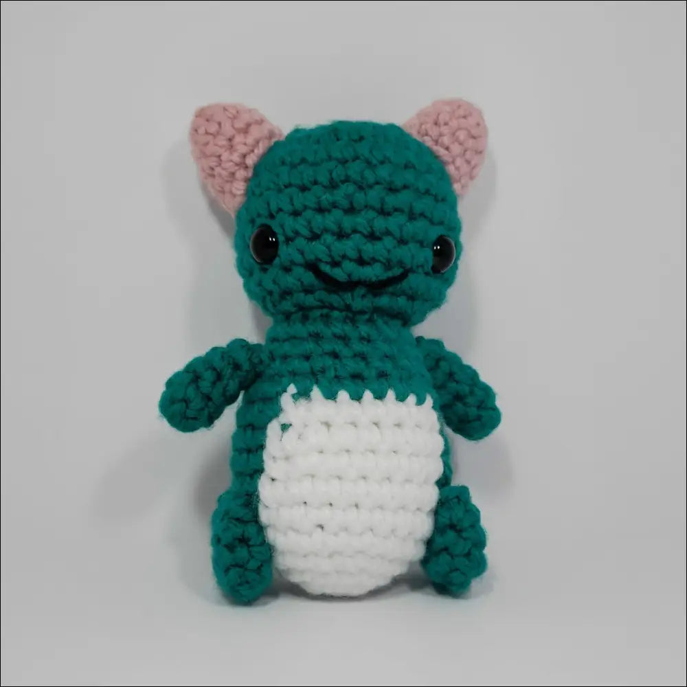 Adorable small green and white Silly Monster Plush with a big eye for laughs and cuddles